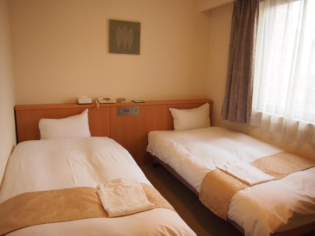 Nest Hotel Kumamoto Rum bild