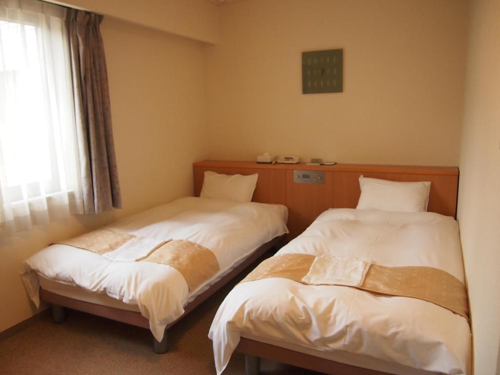 Nest Hotel Kumamoto Rum bild
